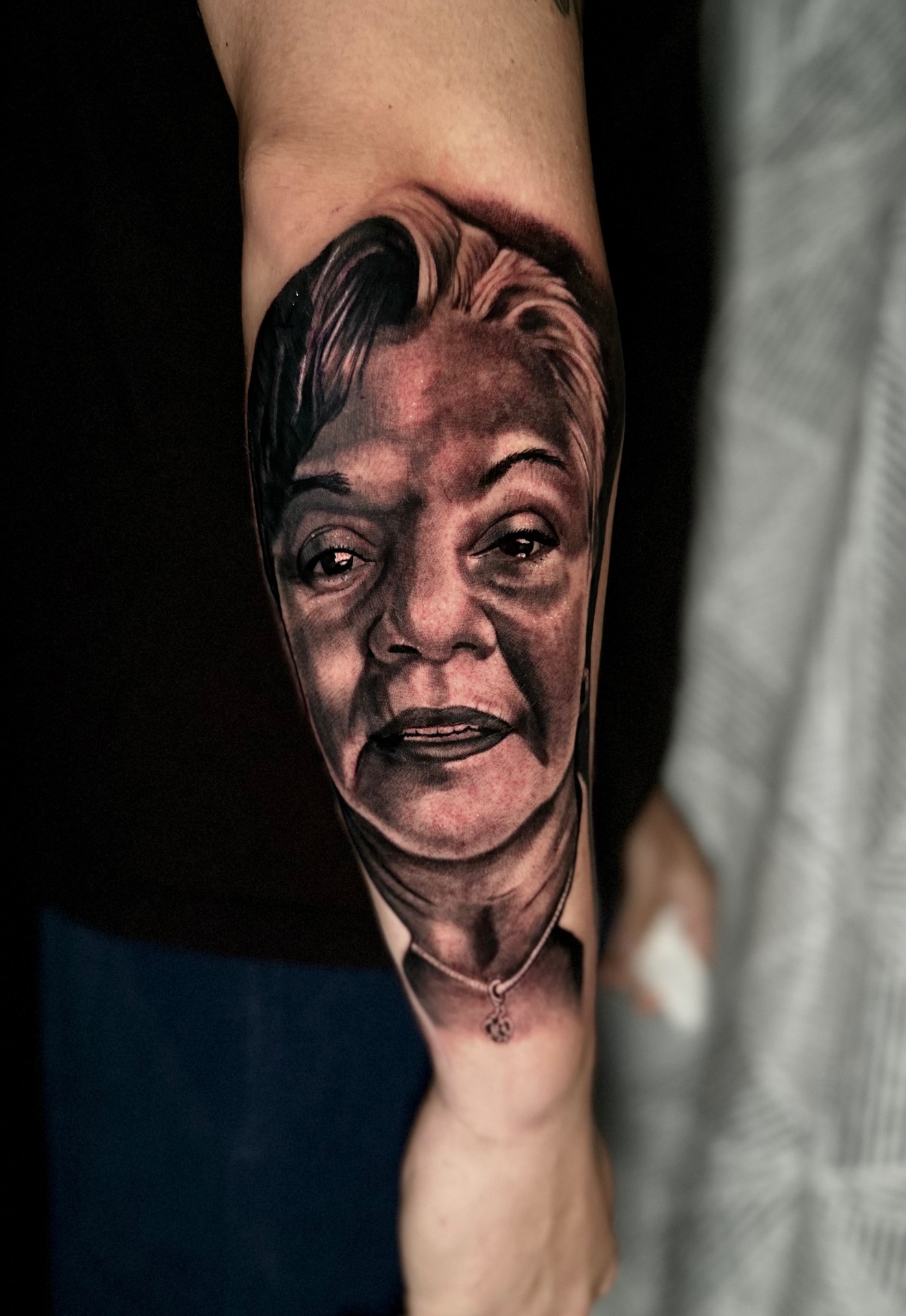 Detailed black and grey memorial portrait tattoo by Ramón Santiago at R INKS ARTS