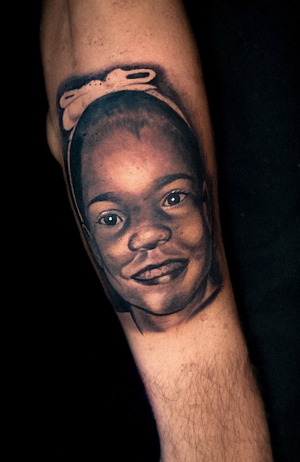 Black and grey portrait of a girl with a bow by Ramón Santiago at R INKS ARTS