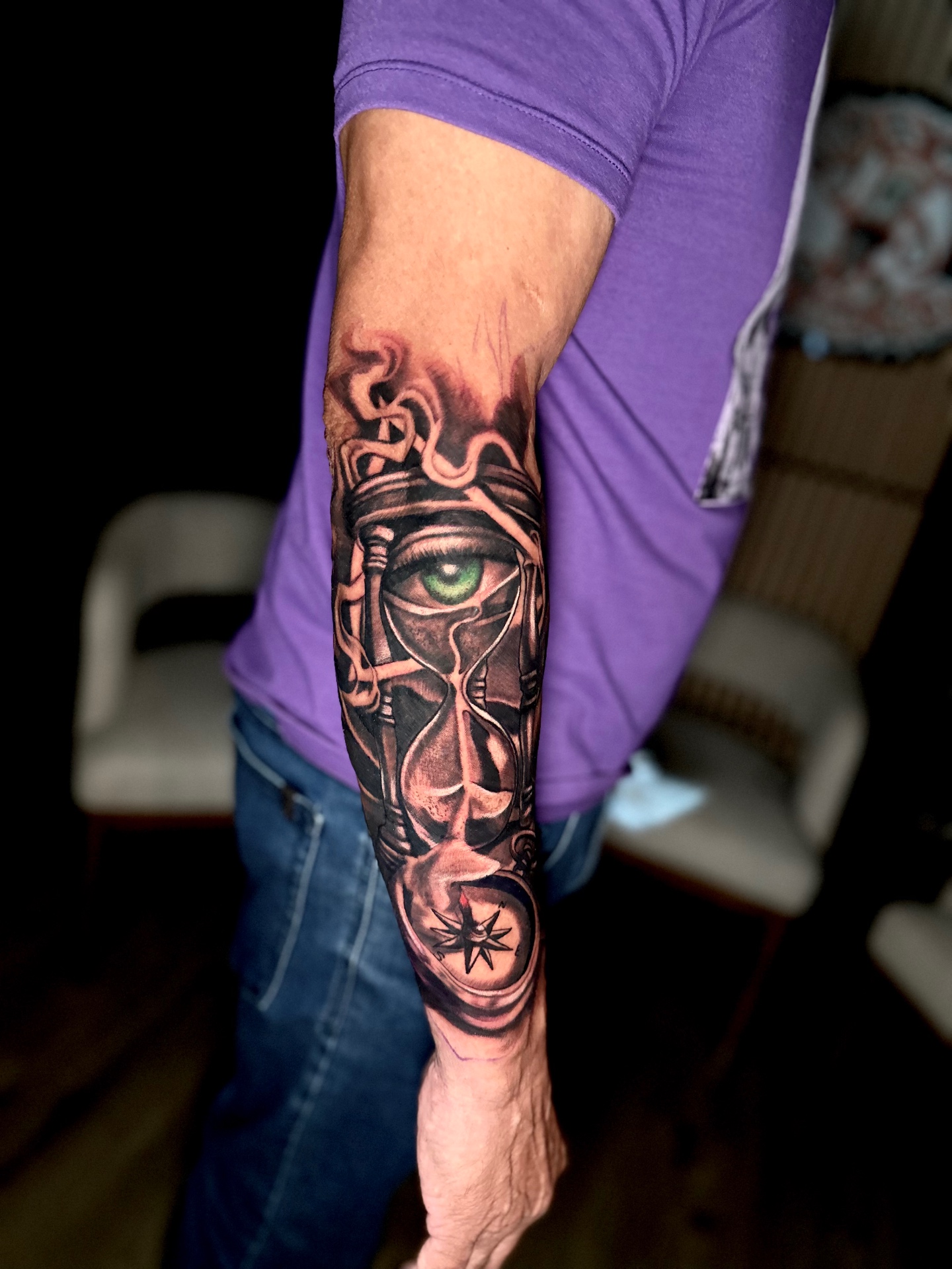 Color realism half sleeve featuring an hourglass, green eye and compass by Ramón Santiago at R INKS ARTS