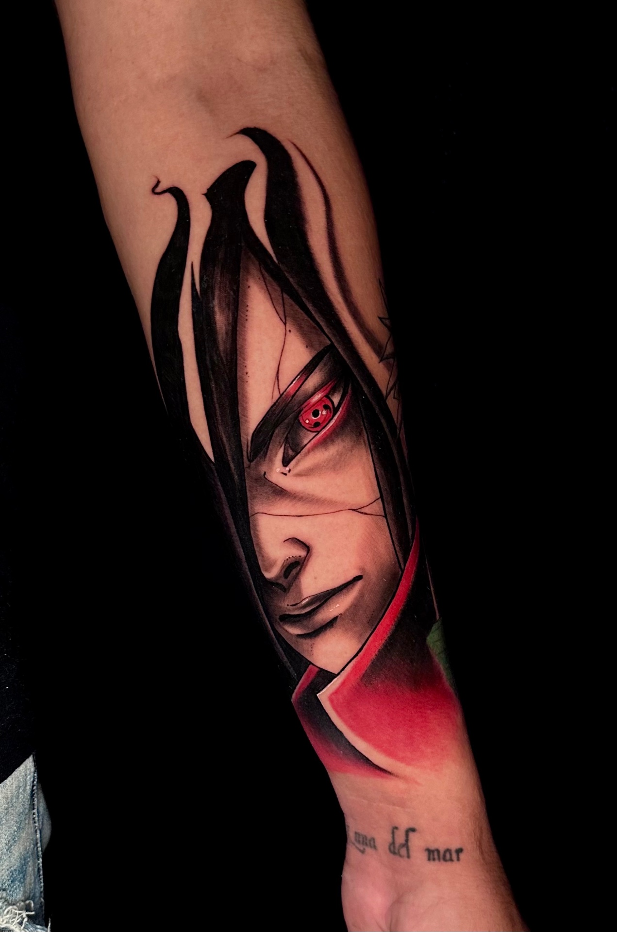 Color anime forearm piece with a red-accented character by Ramón Santiago at R INKS ARTS
